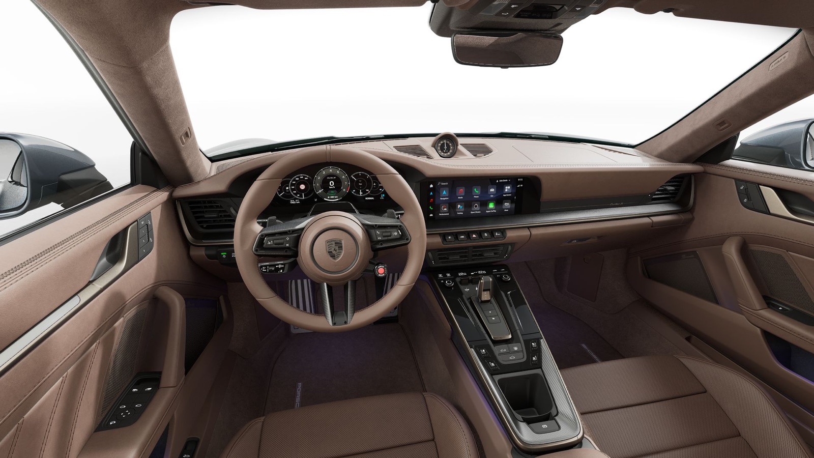 Porsche 911 Turbo S cockpit in Truffle Brown Club Leather with matte carbon trim and the heated GT sport steering wheel