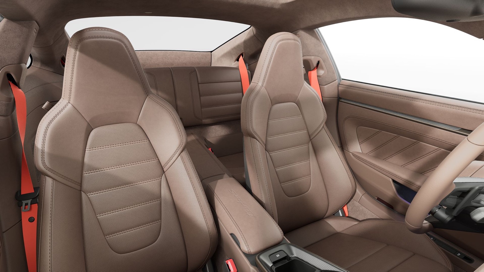 Adaptive sport seats in Truffle Brown leather with Guards Red seat belts inside the Porsche 911 Turbo S