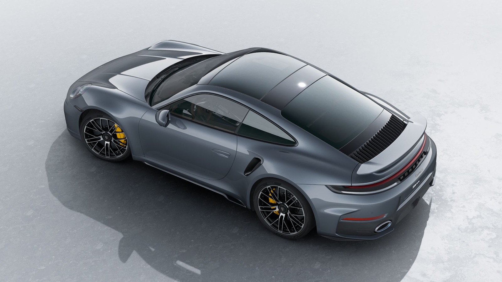 Porsche 911 Turbo S from above, showing the sliding glass sunroof and rear spoiler